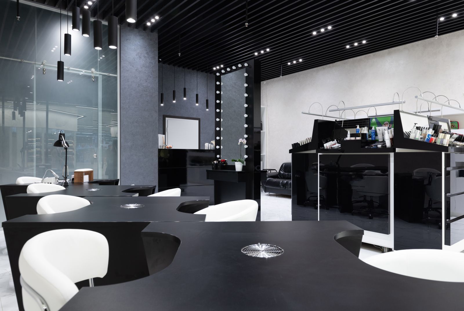 The full studio floor at Lumière, showing the styling chairs and mirrored stations
