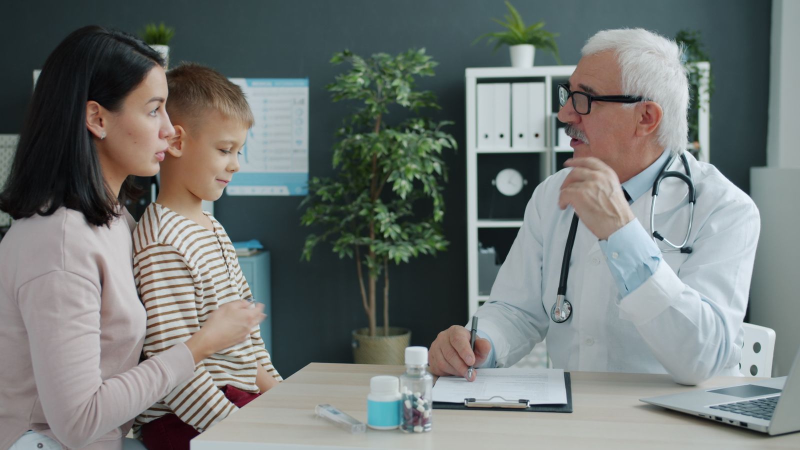 A Clearview GP reassuring a parent and child during a family appointment